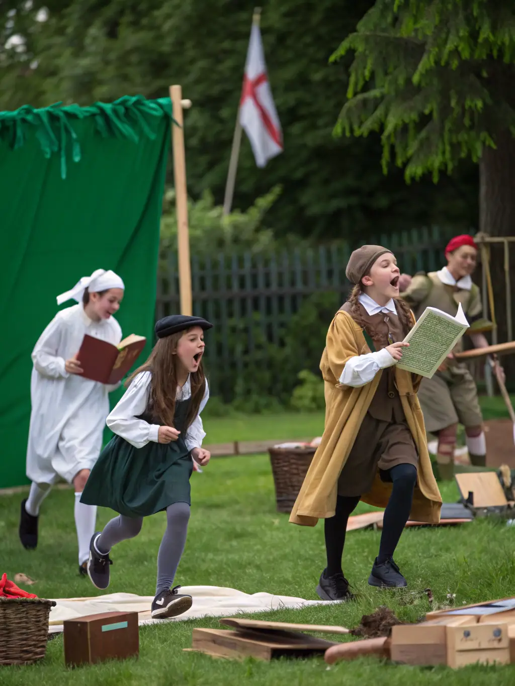 A photograph capturing children participating in a historical reenactment activity at the Adair County Historical Society, dressed in period costumes and engaging with historical tools.